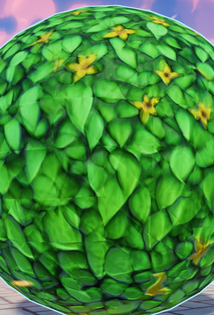A sphere with a leafy green texture applied, the pattern breaking into visible square patches and mismatched seams.